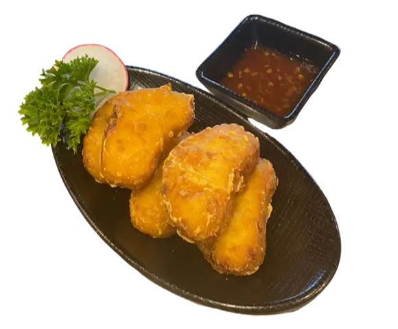 Fried Tofu features golden-brown tofu pieces, crispy on the outside and tender on the inside, served with a side of dipping sauce at Torakichi Ramen, a Japanese Ramen restaurant in Palm Springs
